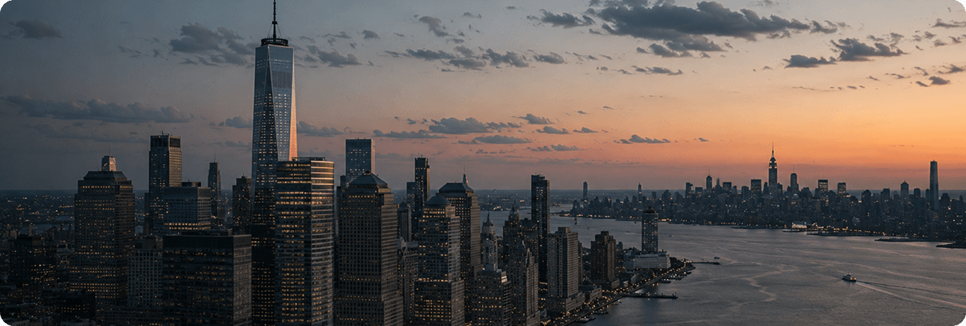 City skyline at sunset with vibrant colors, featuring a boat gently floating on the water in the foreground.